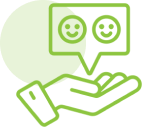 Hand holding speech bubble with smiley faces.